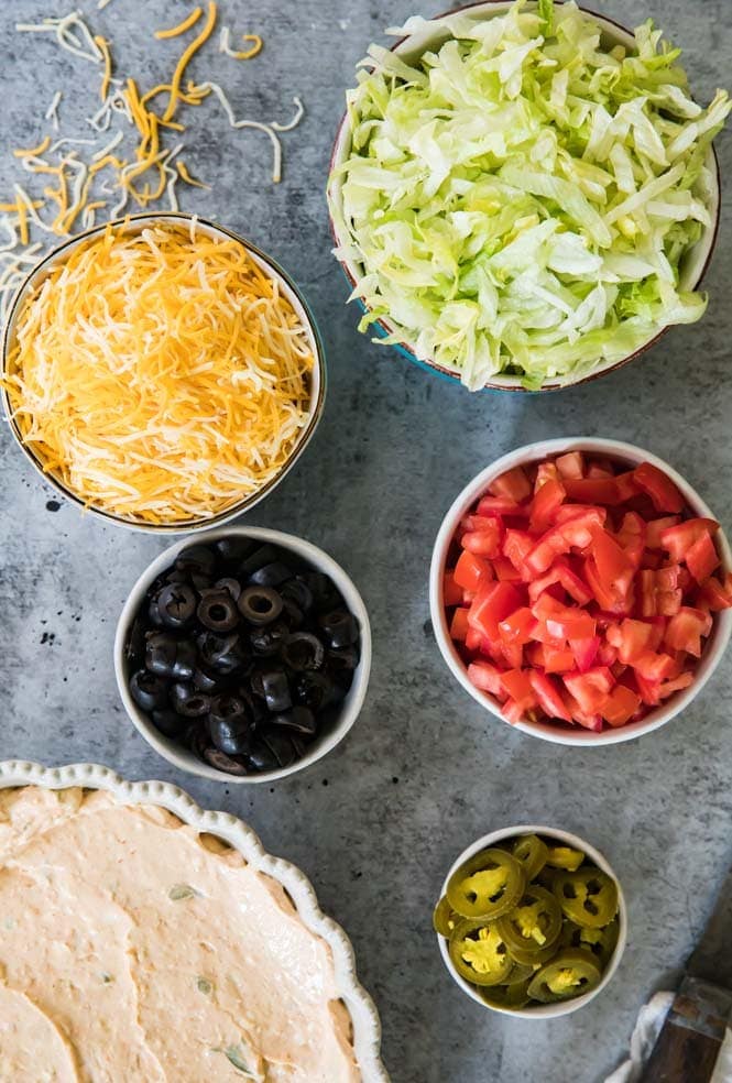 The BEST, easiest Taco Dip! This is so easy to make and so good! #tacodip #recipe #dip #cookout #summerfood Ingredients for taco dip