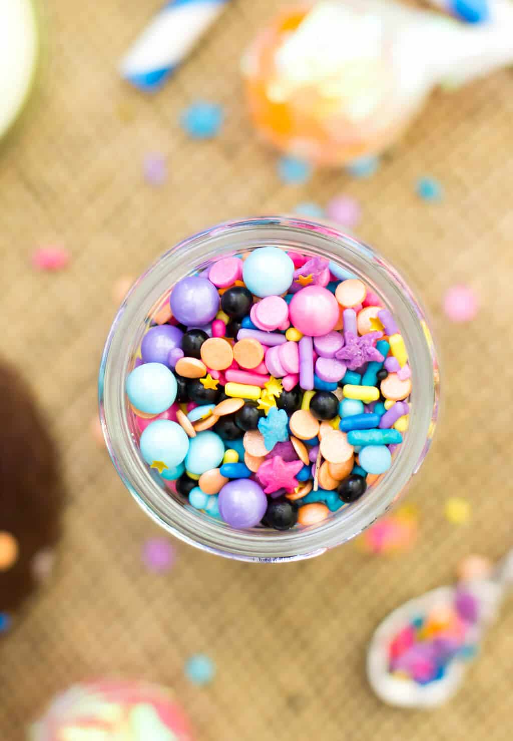 Fill your cupcakes with colorful sprinkles to make PINATA CUPCAKES! A jar of colorful sprinkles