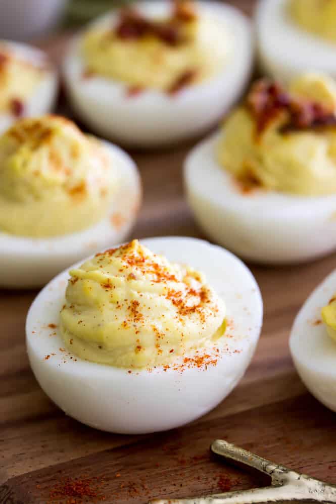 Simply the best deviled eggs recipe! These deviled eggs use a secret ingredient and they are so good! #deviledeggs #easterrecipe Deviled eggs topped with paprika