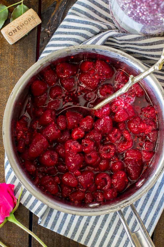 raspberries in chardonnay in saucepan