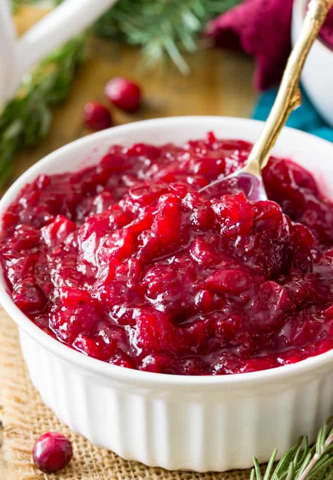 This homemade CRANBERRY SAUCE is so easy to make! It got rave reviews last Thanksgiving so I'm making it again! #thanksgivingrecipe #cranberrysauce Spoonful of cranberry sauce