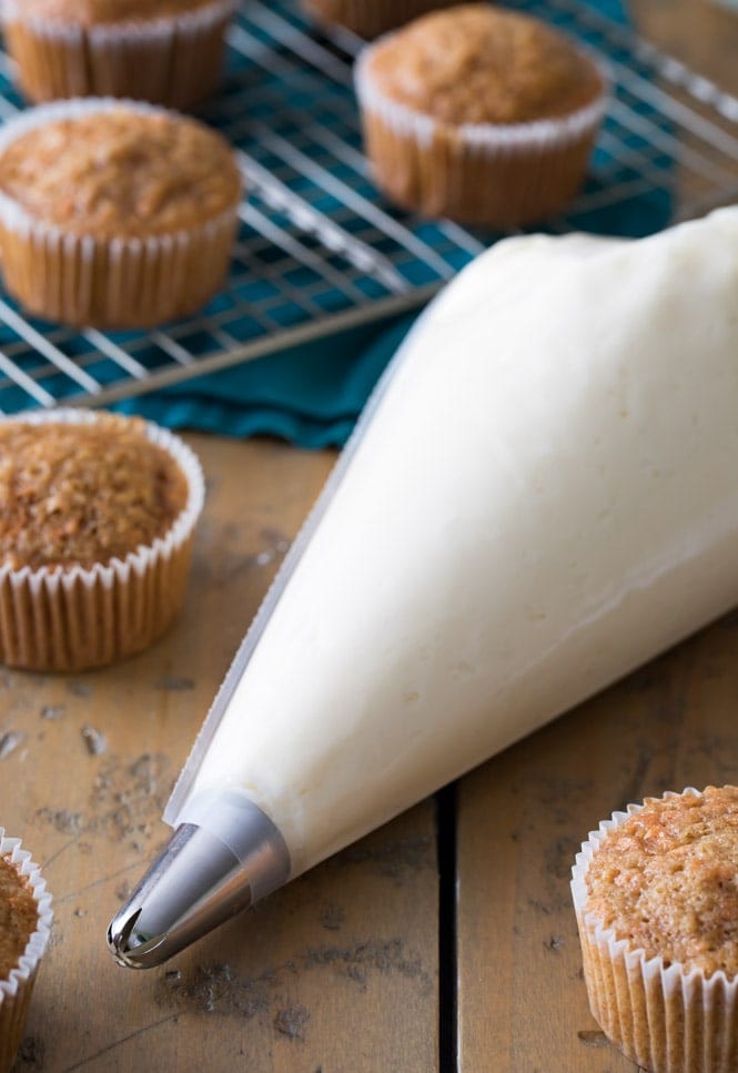 A no-fail cream cheese frosting recipe! Cream Cheese Frosting in a pastry bag