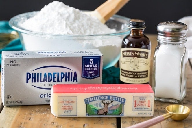 Ingredients for the BEST Cream Cheese Frosting! The 5 ingredients needed to make cream cheese frosting -- powdered sugar, cream cheese, butter, vanilla extract, salt