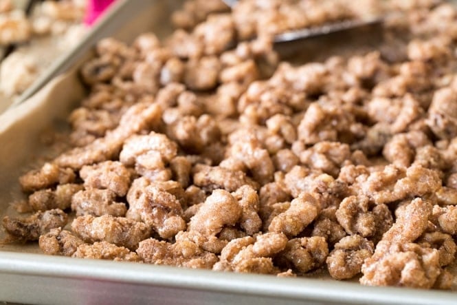 How to make Candied Walnuts -- These are SO GOOD!! #nuts #candiednuts #recipe #walnuts #dessert #baking #easyrecipe Candied walnuts on a pan fresh out of the oven
