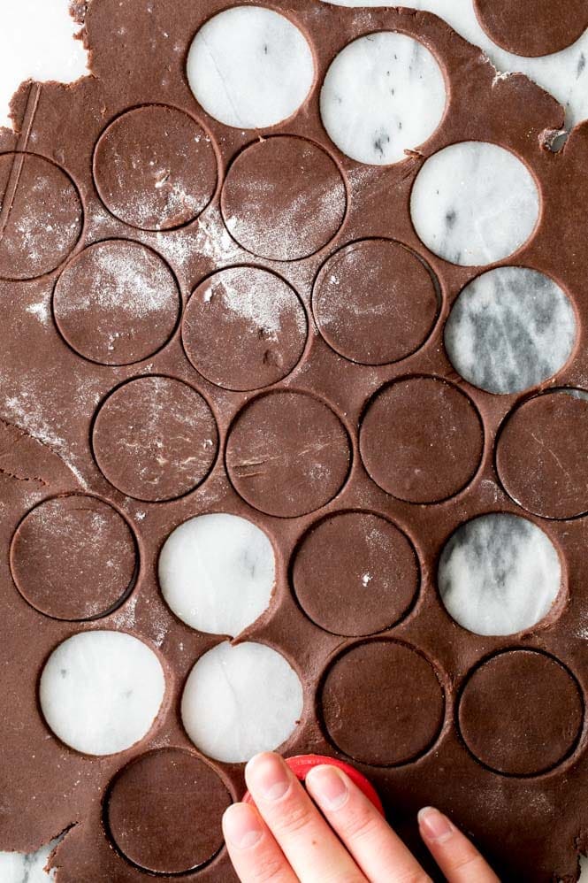 How to make Copycat Thin Mint cookies at home! Chocolate cookie dough that's been rolled out to 1/8" thick and cut into circles to make cookies