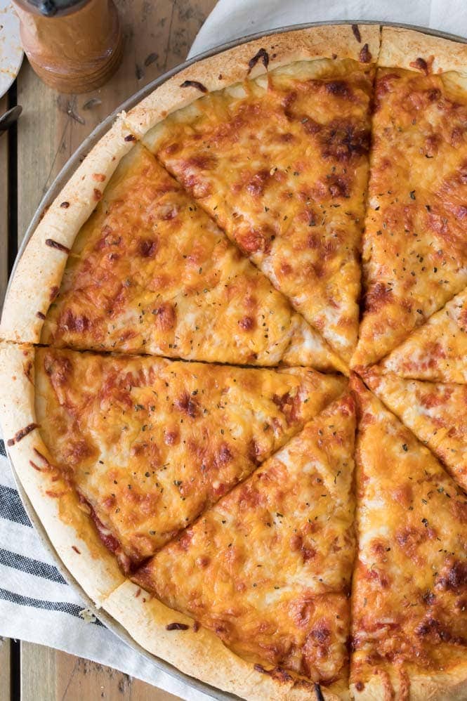 Make a great homemade pizza using this EASY PIZZA DOUGH RECIPE. Cheese pizza made with my pizza dough recipe