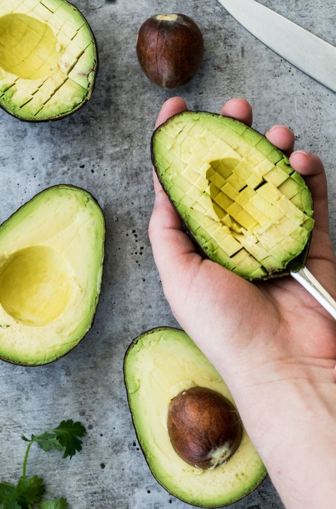 How to easily cut an avocado into small pieces for Texas Caviar Scoring an avocado to easily scoop out the inside