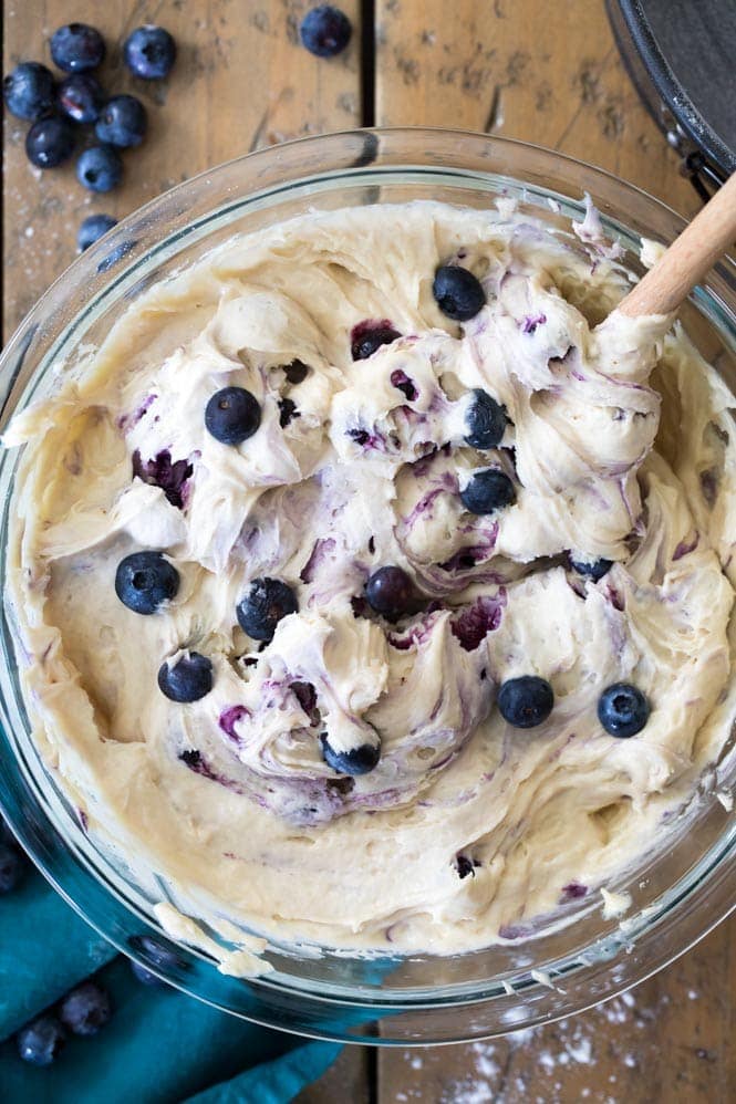 How to make a BLUEBERRY CAKE! Packed full of fresh blueberries and topped off with a lemon glaze, you're going to want to save the recipe for this one! #blueberrycake #cake #recipe #baking #blueberries Blueberry Cake Batter in a bowl