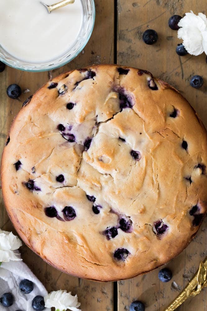 How to make a BLUEBERRY CAKE! Packed full of fresh blueberries and topped off with a lemon glaze, you're going to want to save the recipe for this one! #blueberrycake #cake #recipe #baking #blueberries Freshly baked blueberry cake