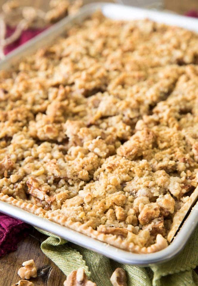 Have you ever made a slab pie? This APPLE SLAB PIE is so simple to make and to serve! #applepie #fallrecipe #fallbaking #applerecipe #Thanksgivingrecipe #thanksgiving Freshly baked apple slab pie