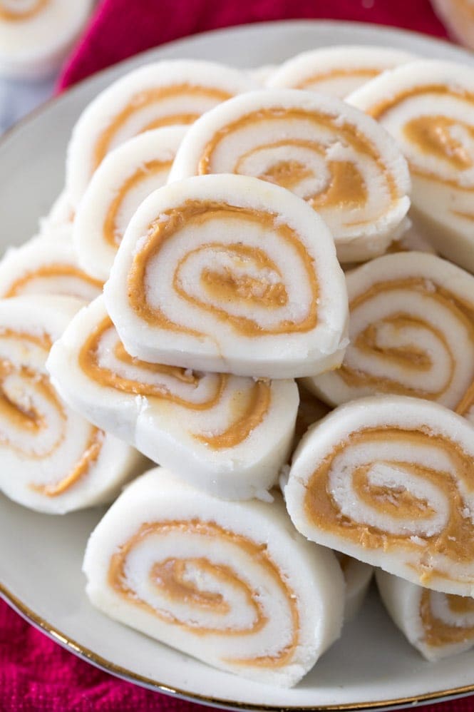 How to make POTATO CANDY! An old-fashioned favorite! #christmascandy #oldfashionedcandy Peanut Butter Pinwheel Potato Candy Recipe on a plate
