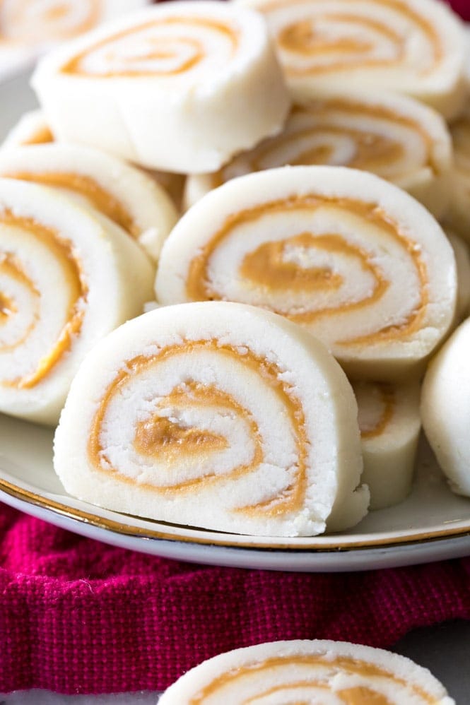 How to make POTATO CANDY! An old-fashioned favorite! #christmascandy #oldfashionedcandy Peanut butter pinwheel potato candy on a plate