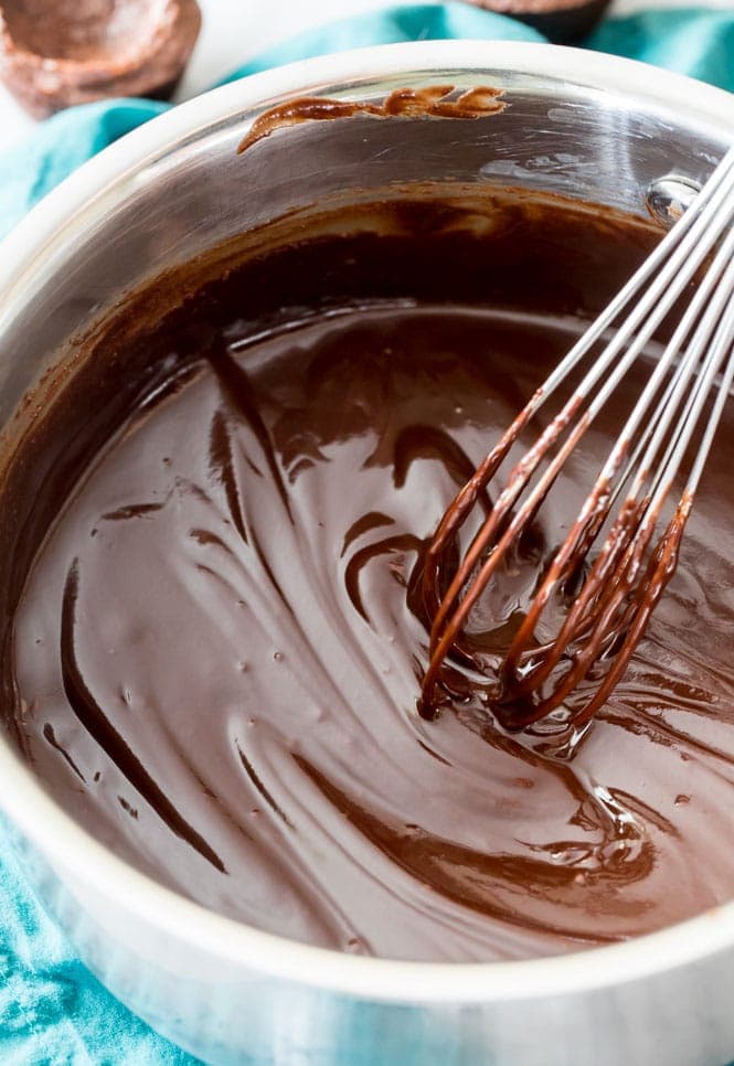 How to make from-scratch BROWNIE BITES! These have a rich ganache center! #brownies #chocolaterecipe #bitesizedtreats Making ganache for brownie bites