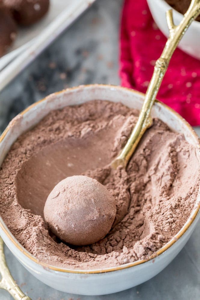 How to make homemade CHOCOLATE TRUFFLES! #homemadecandy #chocolate #chocolatetruffles Rolling chocolate truffle in a cocoa sugar powder