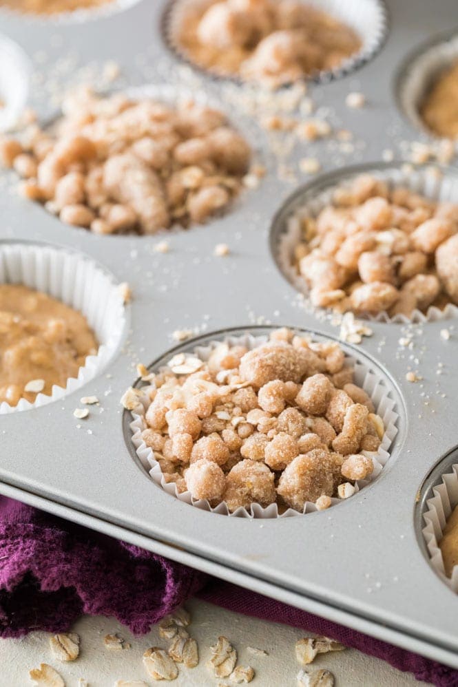 preparing muffin batter and topping with streusel