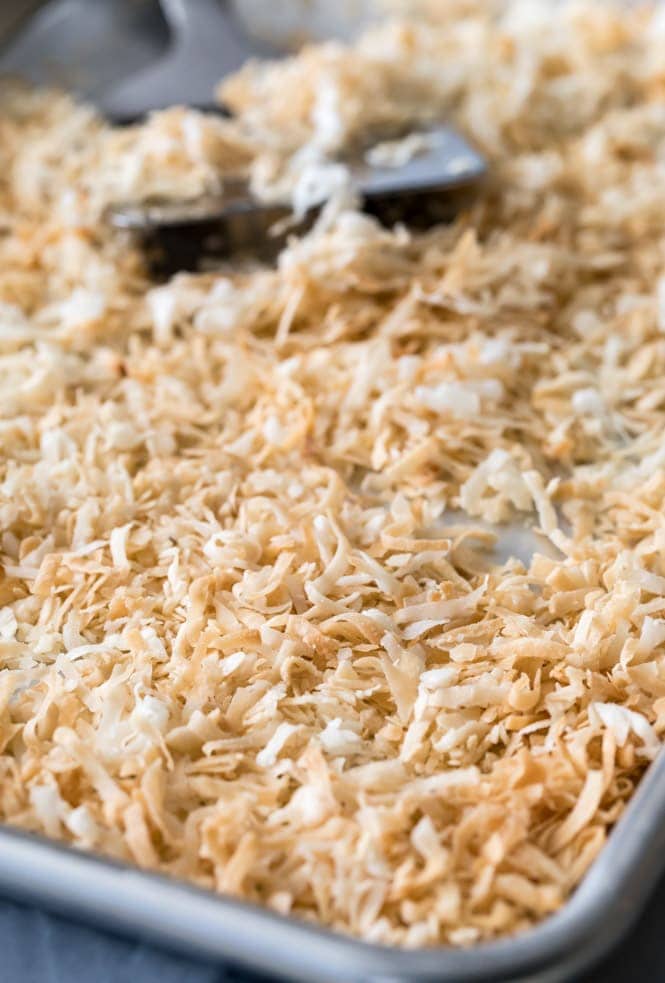 How to make the BEST Coconut Cream Pie! #pierecipe #coconut #coconutcreampie Toasted coconut on baking sheet