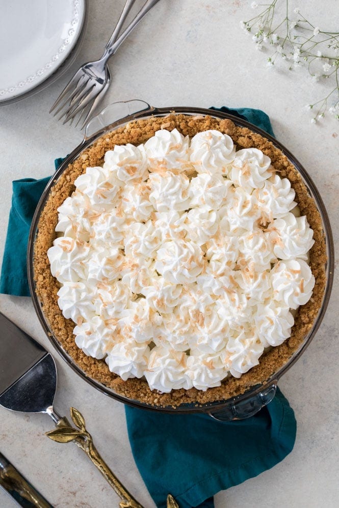 The BEST Coconut Cream Pie Recipe! #pierecipe #coconut #coconutcreampie Overhead of whipped cream topped pie
