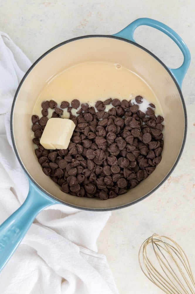 The best EASY Fudge Recipe! It makes the best fudge! #candyrecipe #fudgerecipe How to make easy fudge: ingredients in saucepan