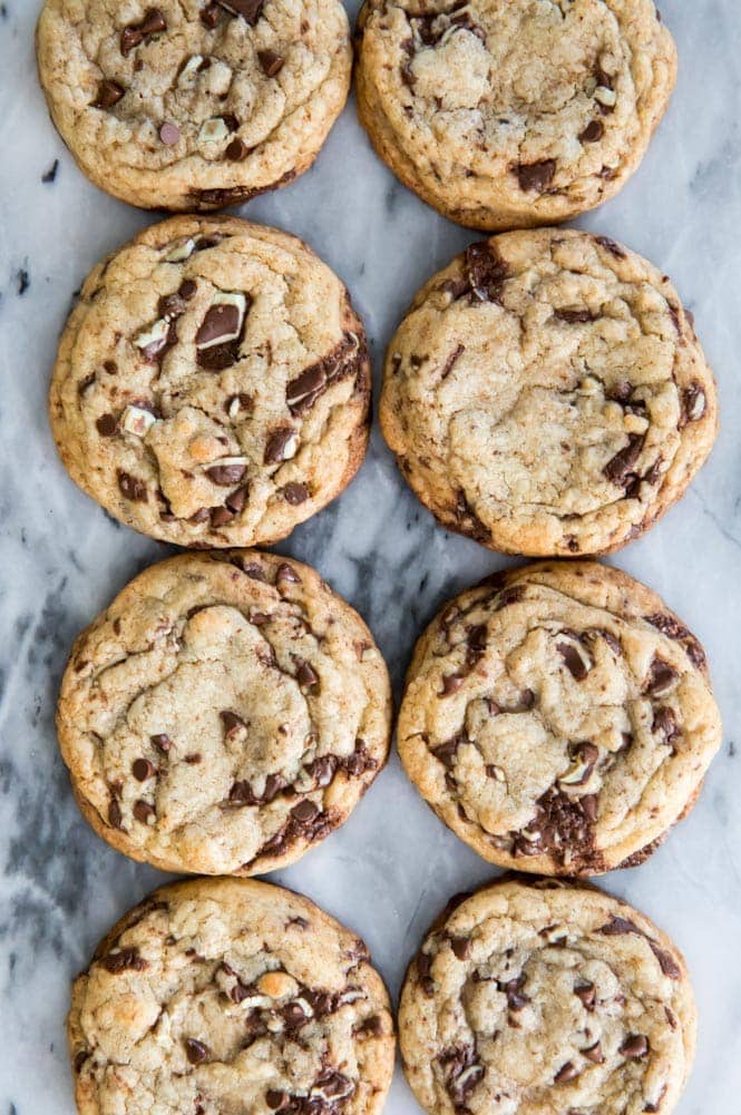 Mint Chocolate Chip Cookies! Soft and chewy, no mixer required. These have just the right balance of mint and chocolate without being overwhelmingly minty. #mintchocolate #stpatricksdayrecipe Mint chocolate chip cookies on marble slab