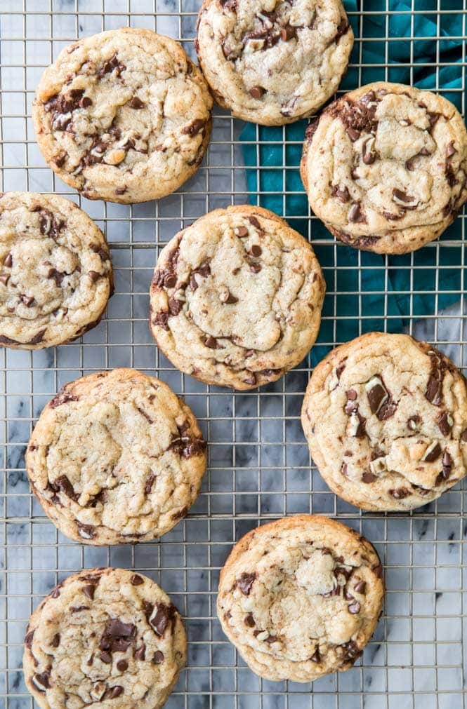 Mint Chocolate Chip Cookies! Soft and chewy, no mixer required. These have just the right balance of mint and chocolate without being overwhelmingly minty. #mintchocolate #stpatricksdayrecipe Mint Chocolate Chip Cookies cooling on cooling rack