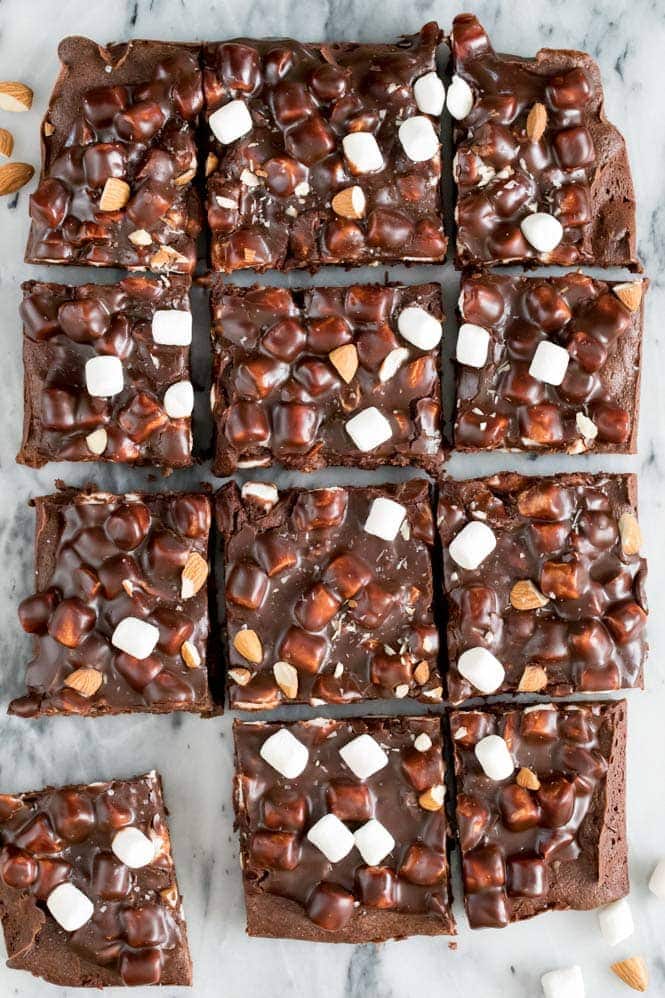ROCKY ROAD BROWNIES! Fudgy, chewy, homemade brownies topped off with a chocolate, marshmallow, and almond coating! These are INCREDIBLE! #brownies #rockyroad Overhead of Rocky Road Brownies cut into 12 pieces