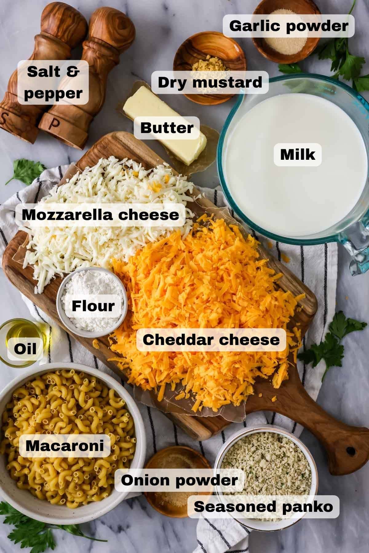 Overhead, labeled view of ingredients needed for baked macaroni and cheese.