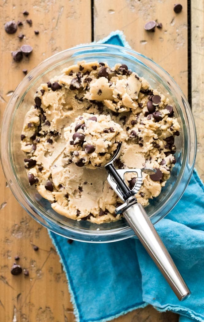 How to make GIANT Chocolate Chip Cookies! These have soft and chewy centers and crisp edges! #chocolatechipcookies #cookierecipe #sugarspunrun Scooping lots of cookie dough for BIG Chocolate Chip Cookies