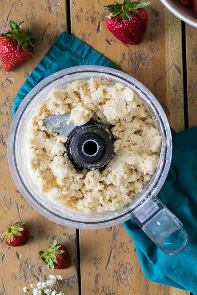How to make a sweet and simple STRAWBERRY COBBLER! Easy and made completely from scratch, this recipe is a great way to use up summertime berries! #strawberryrecipe #cobblerrecipe #sugarspunrun #summerbaking Making strawberry cobbler topping in food processor