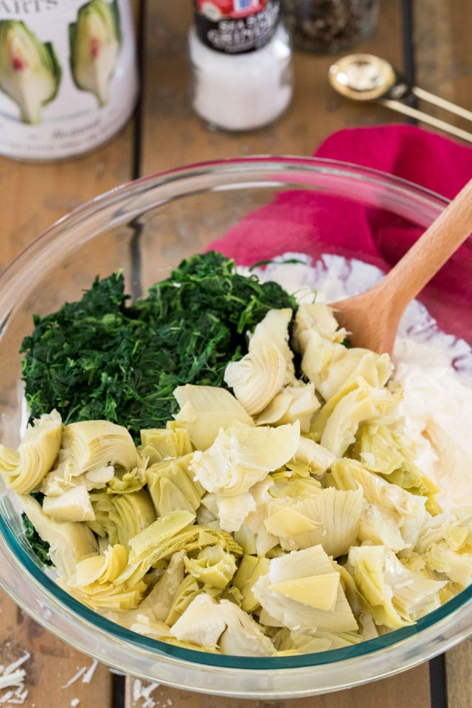 How to make the BEST Spinach Artichoke Dip! This is a creamy, easy, cheesy recipe! #sugarspunrun #spinachartichokedip #potluckrecipe Combining all spinach artichoke dip ingredients in large mixing bowl