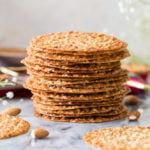 Stack of lace cookies on marble surface