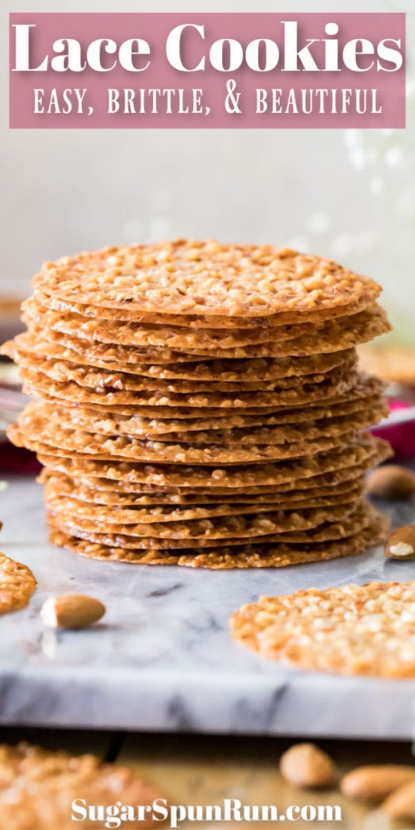 Lace cookies stacked on marble surface