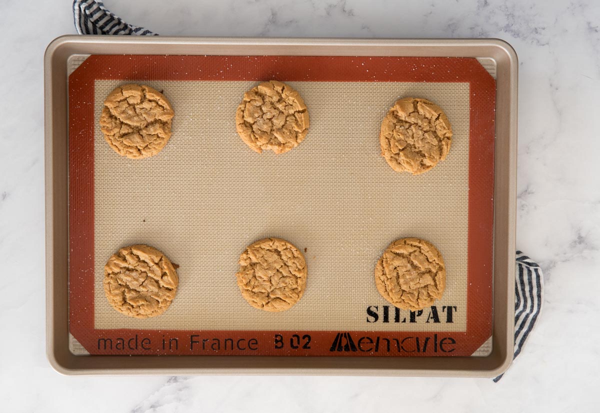 flourless peanut butter cookies on a silpat lined baking sheet
