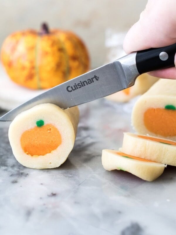 slicing pumpkin sugar cookie dough
