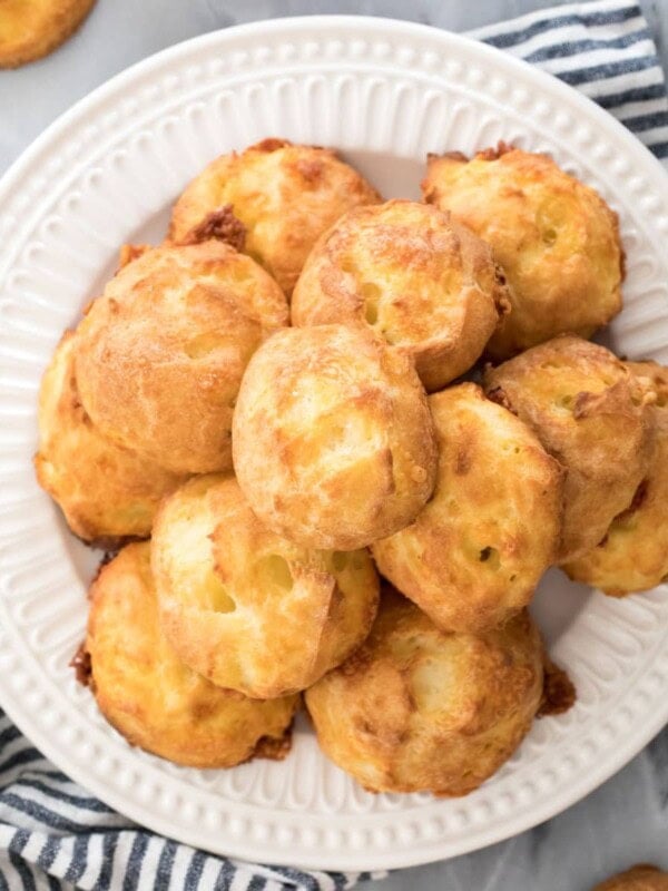 pile of cheese puffs on white plate