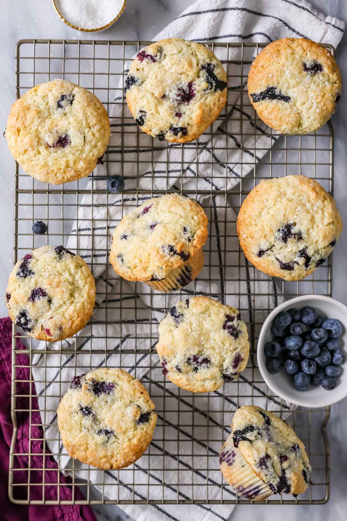Muffins from my blueberry muffin rrecipe on a cooling rack.