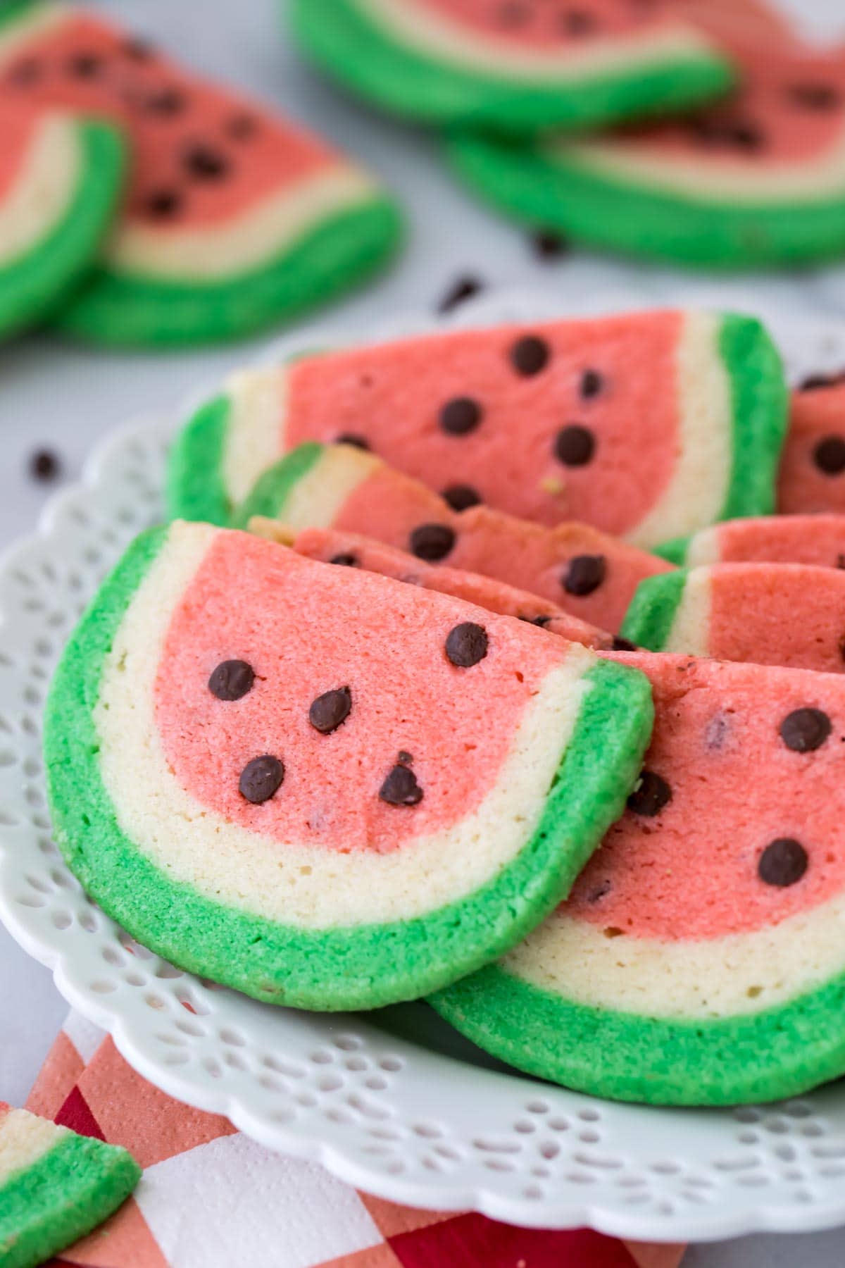 Watermelon sugar cookies arranged on a white plate
