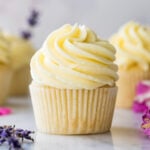side view of cupcake frosted with thick, silky German buttercream icing