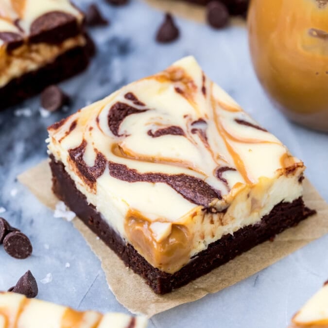Chocolate brownie covered in a cream cheese filling swirled with chocolate and dulce de leche