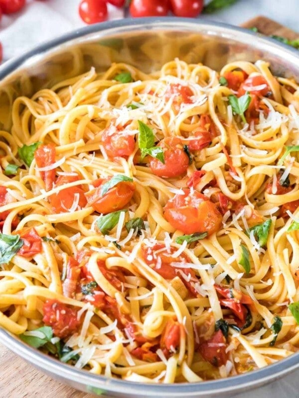 summer pasta with fresh cherry tomatoes and basil served in a skillet