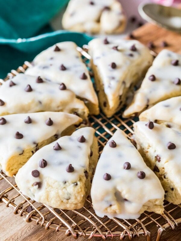 Triangular chocolate chip scones arranged in a circle on a cooling rack.