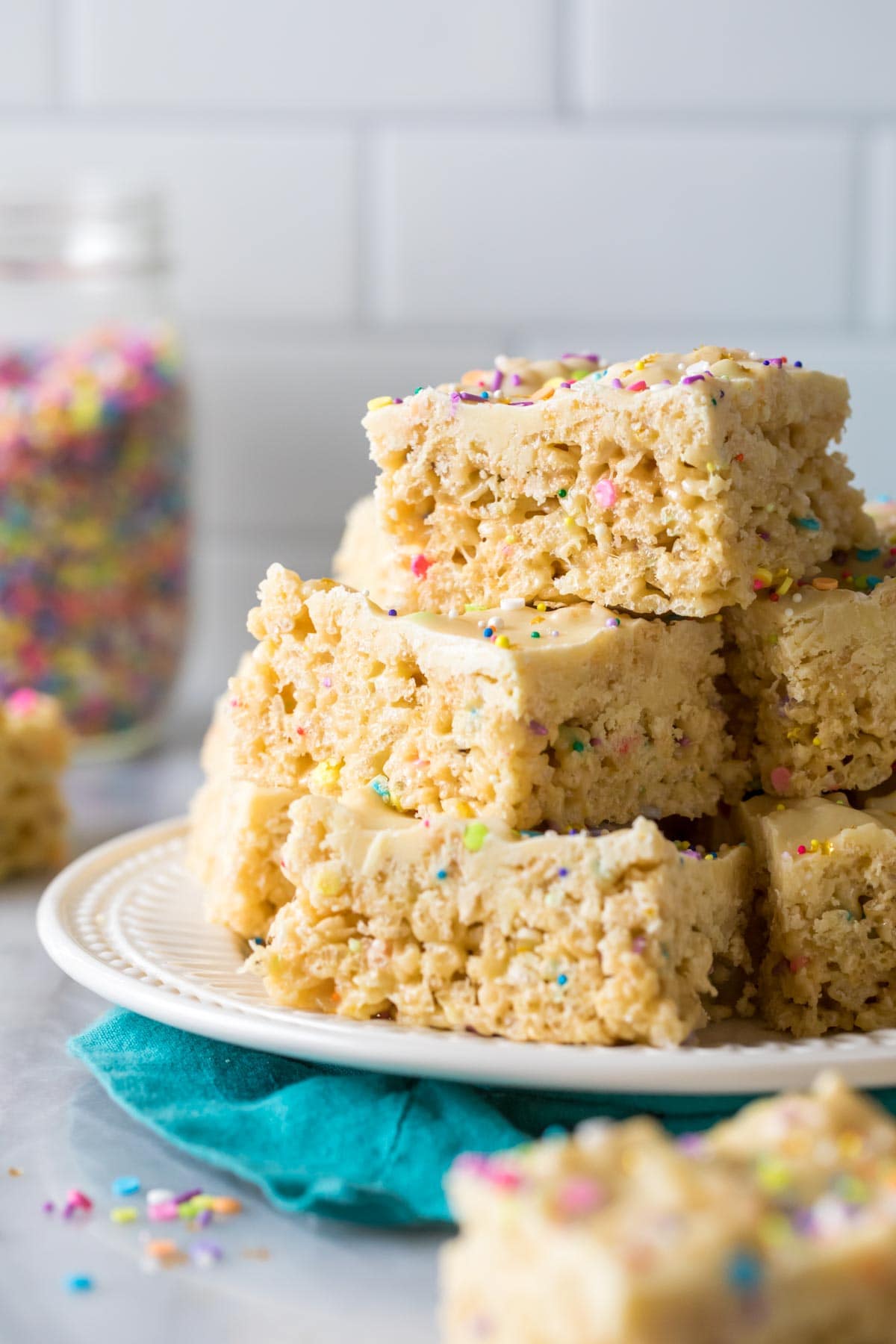 Plate of stacked cake batter rice krispie treats.
