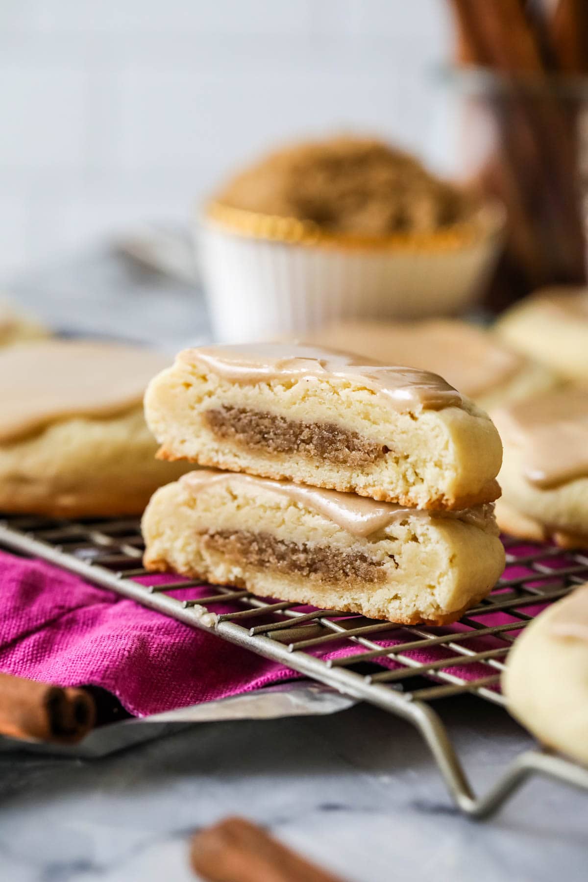 Two halves of a brown sugar cinnamon pop tart cookie stacked on top of each other.