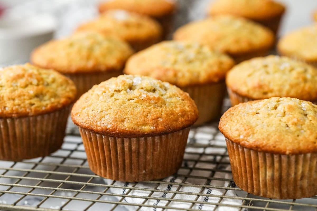 Rows of sourdough banana muffins on a cooling rack.