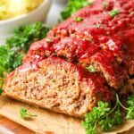 Meatloaf with one slice cut to show the interior.