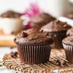 Chocolate banana muffins on a cooling rack.