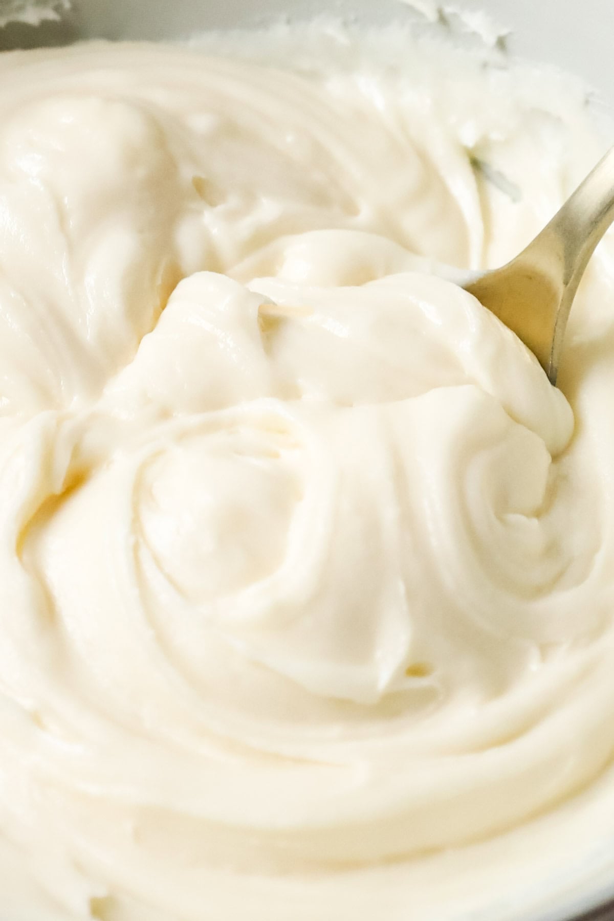 Close-up view of cinnamon roll icing.