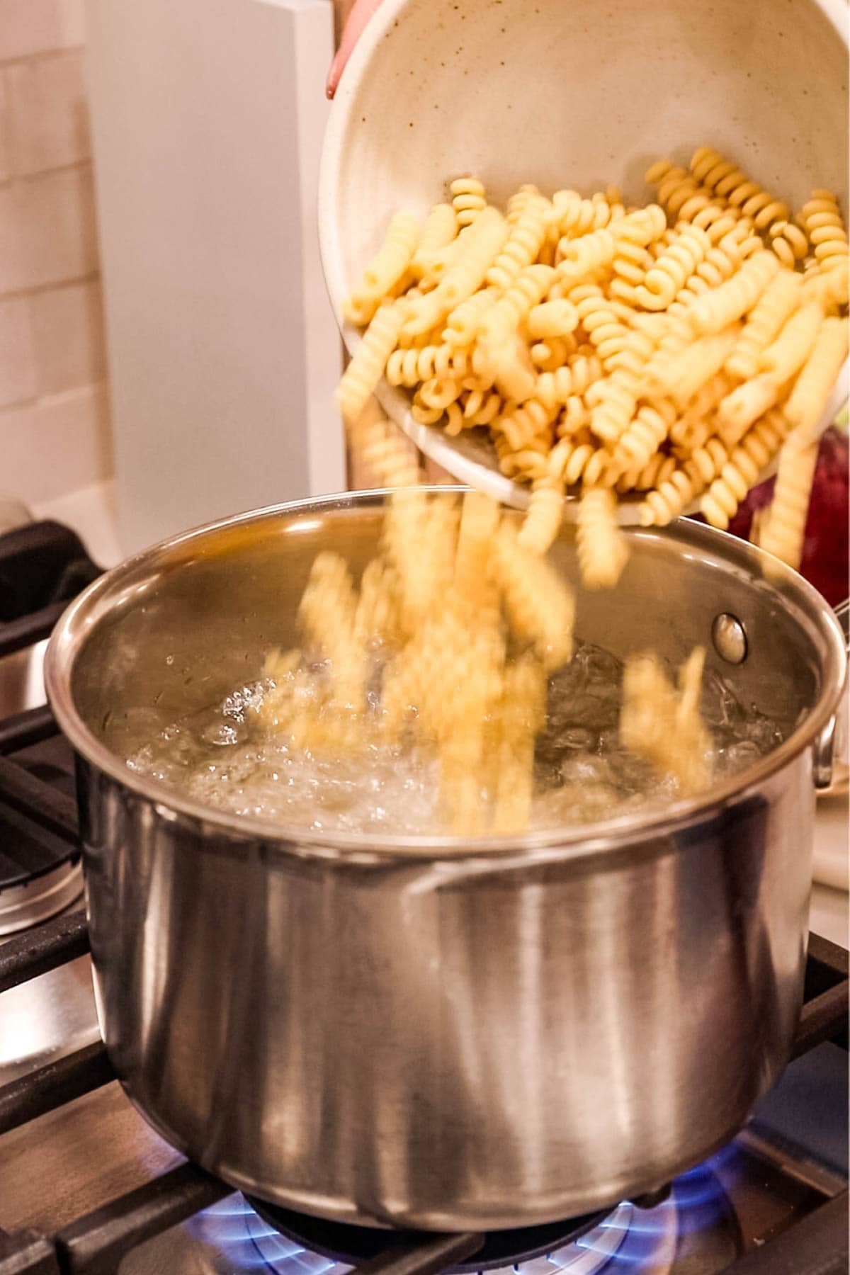 Boiling pasta for pasta salad.