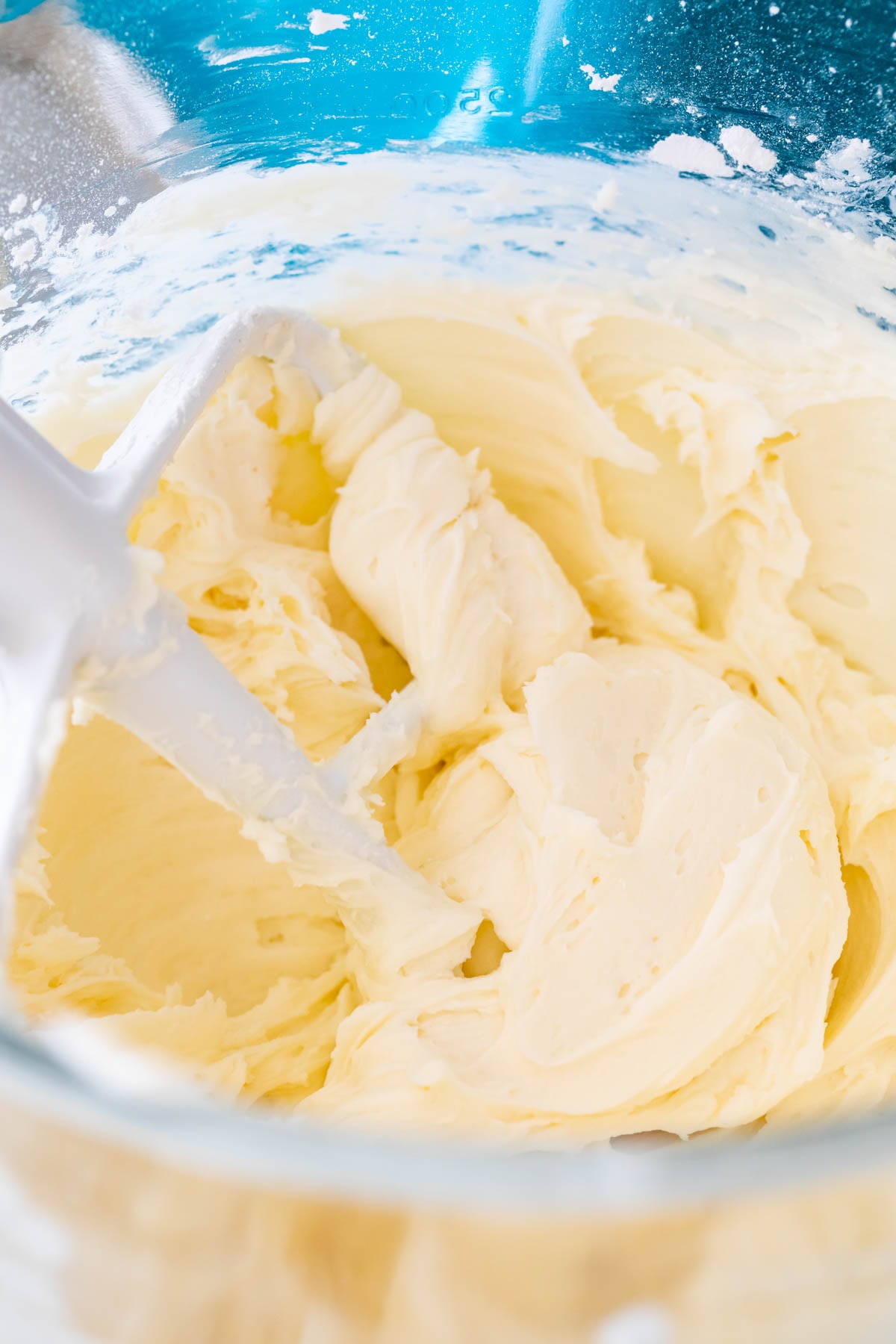 Close-up view of fluffy buttercream frosting after whipping in heavy cream.