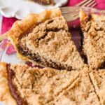 Shoofly pie that's been cut into slices in a pie plate.