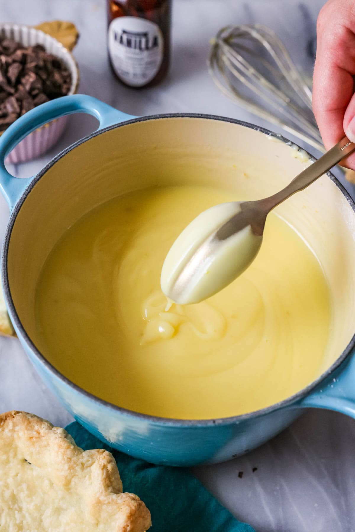 Spoon dipped into a custard showing perfect consistency.